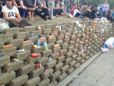 A wall of free food, drink and supplies in Gezi. Also contains antacid for tear gas