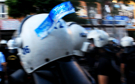 Police in Ankara seem to cover the identification numbers on their helmets with tags